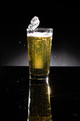 glass of beer on dark background