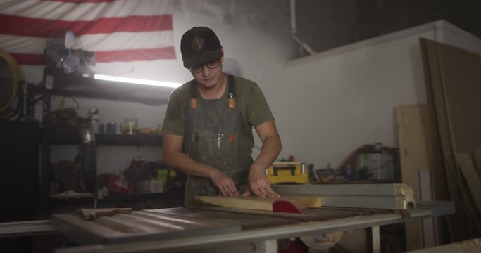 Woodworker man working in garage