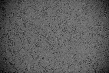 Black and white background with a pattern. Gray background with a pattern. Odd color background. Abstraction.
