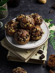 chocolate muffins with nuts on a dark background