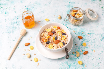 Healthy breakfast. Fresh granola, muesli with nuts and frozen berries. Top view. Copy space.