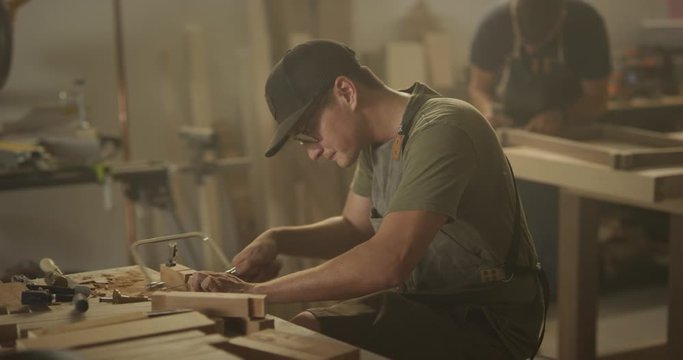 Woodworker men working in garage