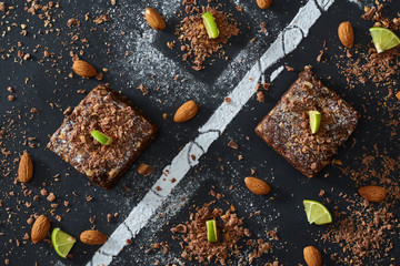 brownies whit lemon on black table