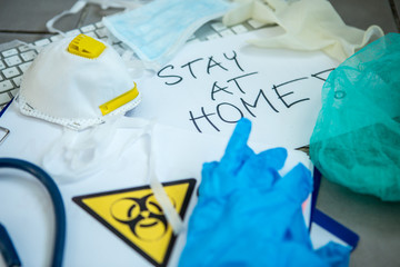 Coronavirus Epidemic Outbreak. Close-up of protective gloves, face-mask, respirator and bio hazard symbol. 