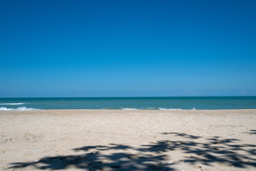 Fototapeta na wymiar Dark blue sky on the sand beach, Thailand
