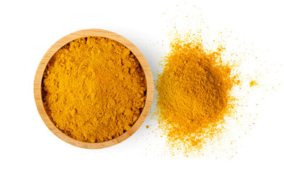 Turmeric powder in wood bowl on white background