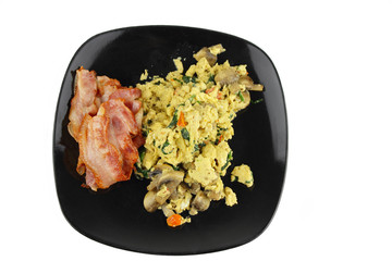 Scramble egg and bacon with a white background