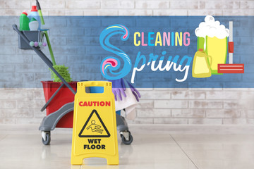 Caution sign with supplies indoors. Spring cleaning
