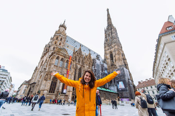 smiling happy woman portrait in front of vienna cathedral church