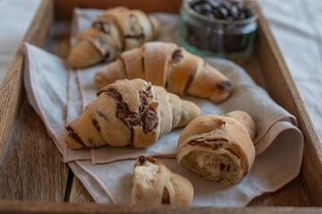 home made croissant filled with chocolate on a plate