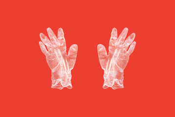 latex glove on a red background