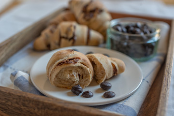 home made croissant filled with chocolate on a plate