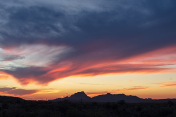 Fototapeta premium Colorful sunset sky with mountain silhouette