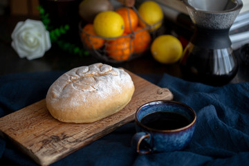 homemade artisanal wholewheat bread on cutting board