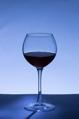 glass of white wine on a black background