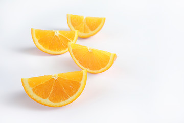 Cut fresh juicy orange isolated on white