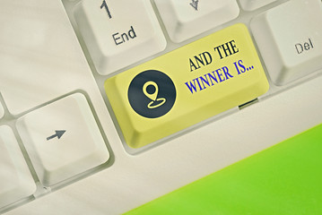 Conceptual hand writing showing And The Winner Is. Concept meaning announcing a demonstrating or...