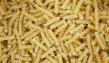 uncooked pasta background, healthy food closeup