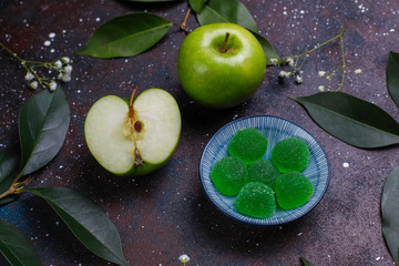 Apple green marmalade candy in sugar. Healthy dessert for gourmets.