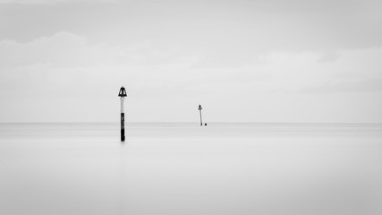 Black and white image of Idyllic morning at Milford beach
