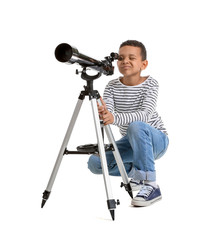 Little African-American boy with telescope on white background