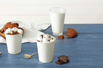 Cups of hot chocolate on table