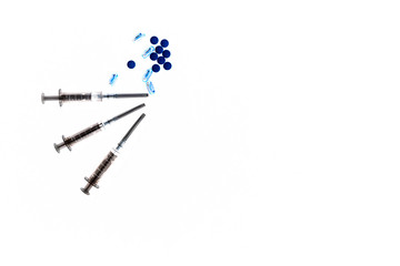 Medical syringes and tablets.