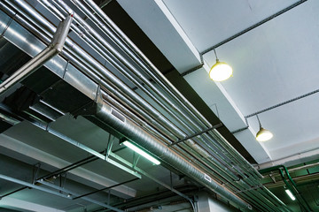Obraz premium metal pipes under the ceiling
