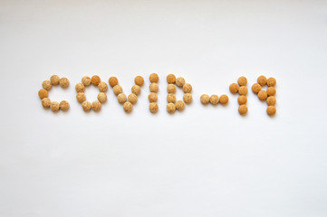 Covid-19 written with pills