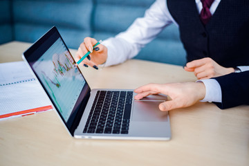 woman and man in business suits in office