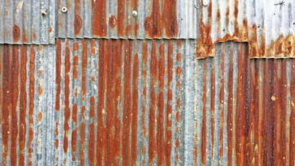 Rust on Galvanized corrugated sheet, rustic background, weathered background. Metal sheet with rusty.