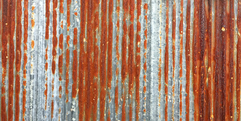 Rust on Galvanized corrugated sheet, rustic background, weathered background. Metal sheet with...
