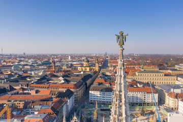 Fototapeta premium Muenchner Kindl statue on the New Town Hall (Neues Rathaus), in Munich, Germany