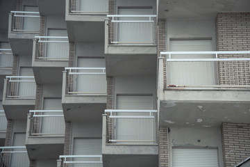Winter sea mood in the Riviera Romagnola region of Italy. Facade details of hotels and residential buildings closed for the winter season.
