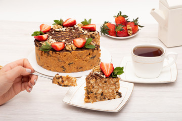 cake anthill with strawberries and nuts