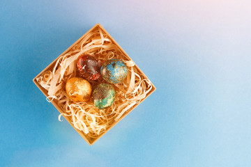 Four multi-colored easter eggs.