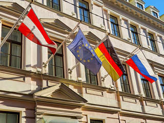 flags in front of an old building
