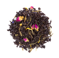 Dry black tea with flower petals and buds of roses isolated on white background