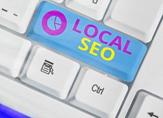 Writing note showing Local Seo. Business concept for helps businesses promote products and services...