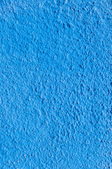 Fototapeta na wymiar view to blue plaster wall as harmonic mediterranean background
