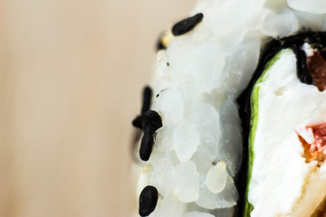 macrophotography of rolls on a wooden Board. Japanese food on the table is close.