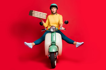 Portrait of her she nice attractive girlish cheerful cheery girl riding moped without legs having fun carrying dessert package isolated on bright vivid shine vibrant red color background
