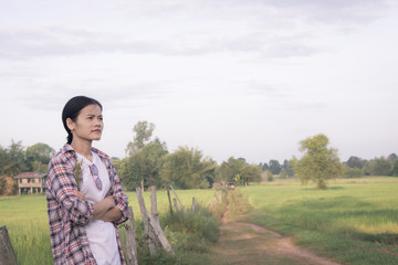 Beautiful asian woman stand relaxing at countryside.