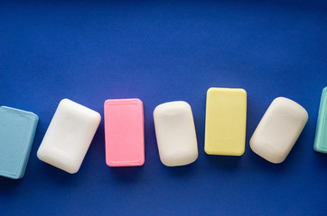 Various soap bar on a blue background
