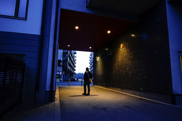 Stockholm, Sweden A man walks through a portal in Liljeholmskajen.