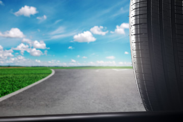 Fototapeta premium car summer tires on the background of the road