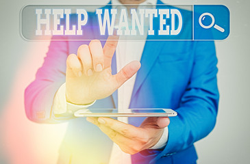 Conceptual hand writing showing Help Wanted. Concept meaning An ad in the paper an employer places...