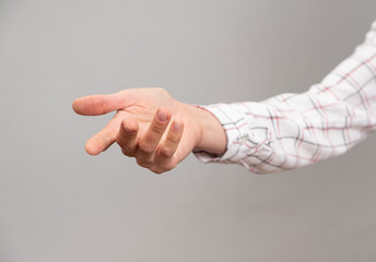 Female hand shows a gesture of request