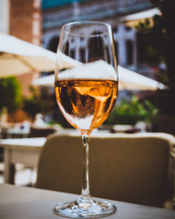 Glass of rose wine on an Italian terrace in summer, outside 