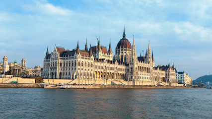 Fototapeta premium beautiful building of the Hungarian parliament against the background of the river and blue sky